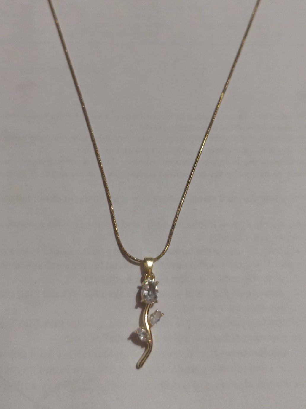 Gold branch pendant necklace with clear crystal accents