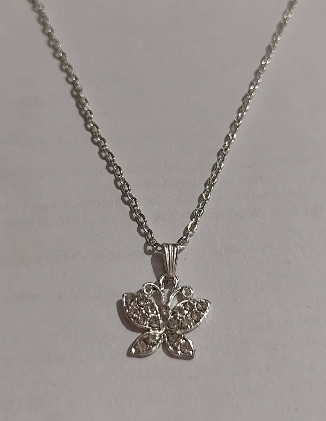 Silver butterfly pendant necklace with cubic zirconia paved wings