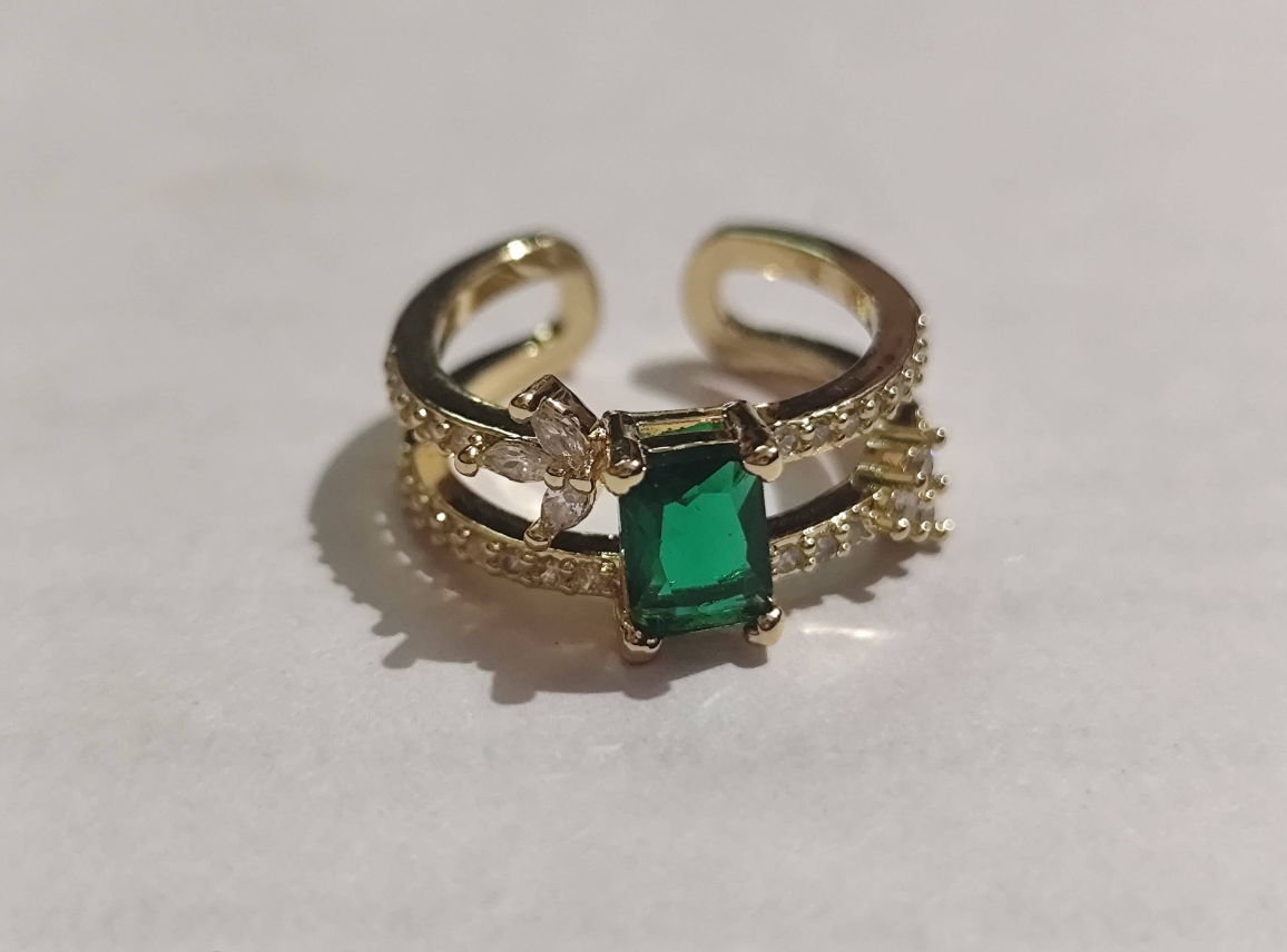 Gold adjustable open ring with emerald-cut green crystal and cz accents