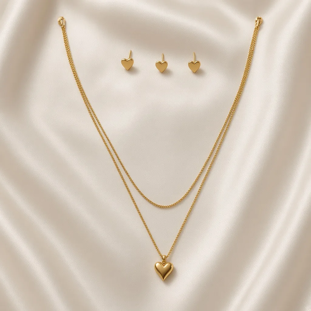 Gold layered necklace with puffy heart pendant and matching heart stud earrings — anti-tarnish set by The Luxe Jewels