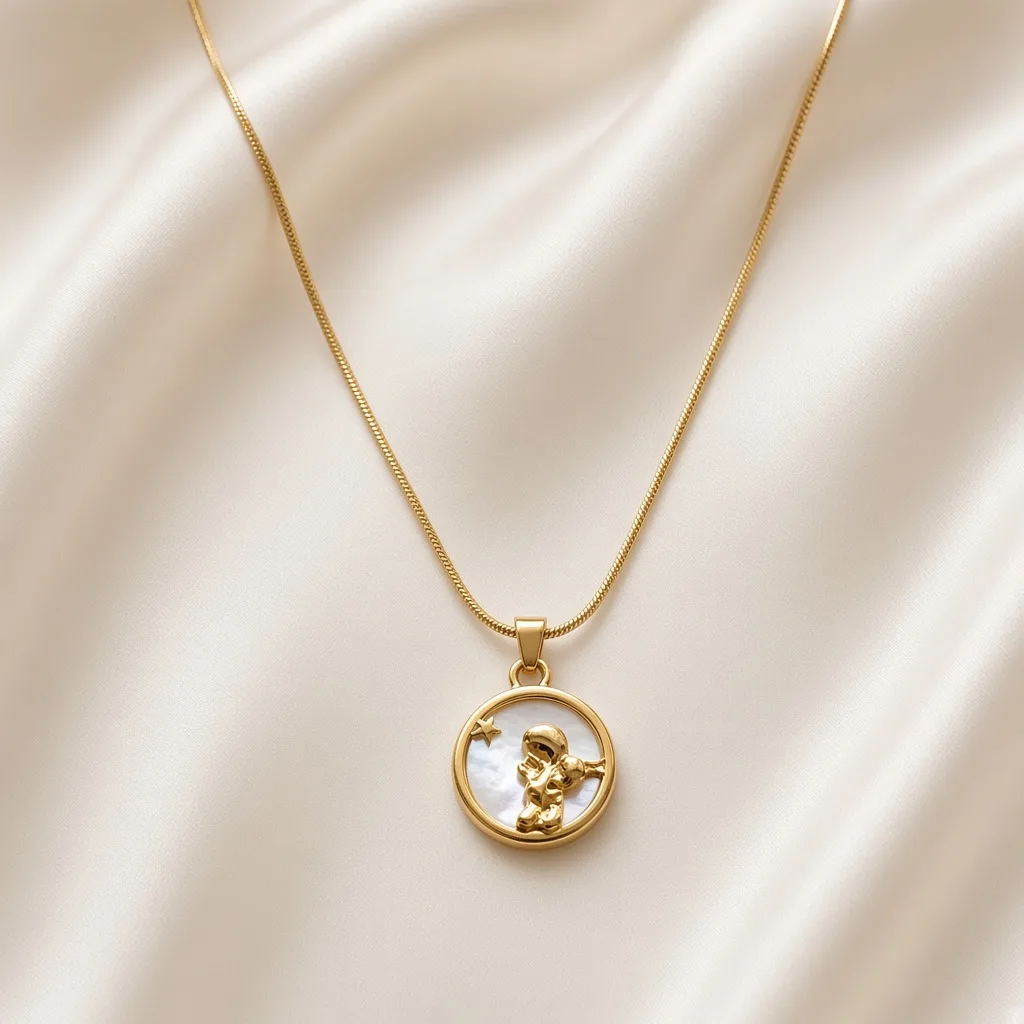Gold necklace with a round coin-style engraved pendant on a fine chain