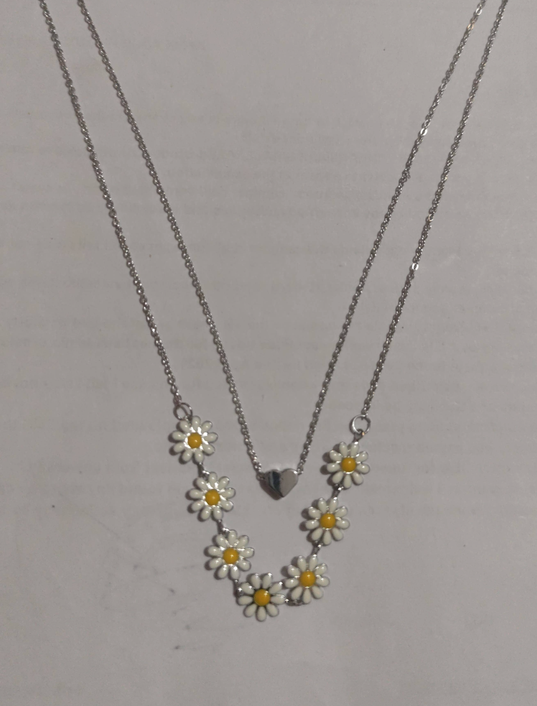Silver layered necklace with heart charm and enamel daisy flowers