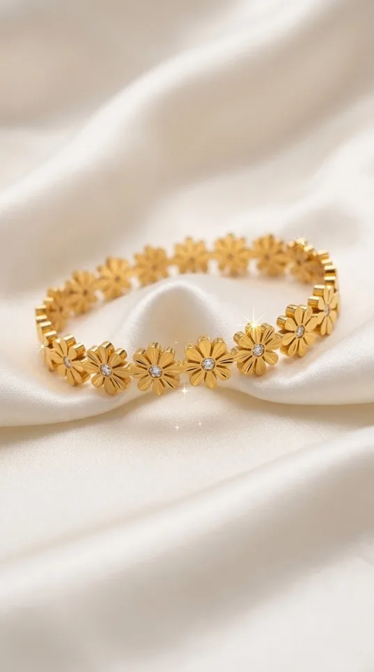 Gold daisy flower link bracelet with crystal centers on satin fabric