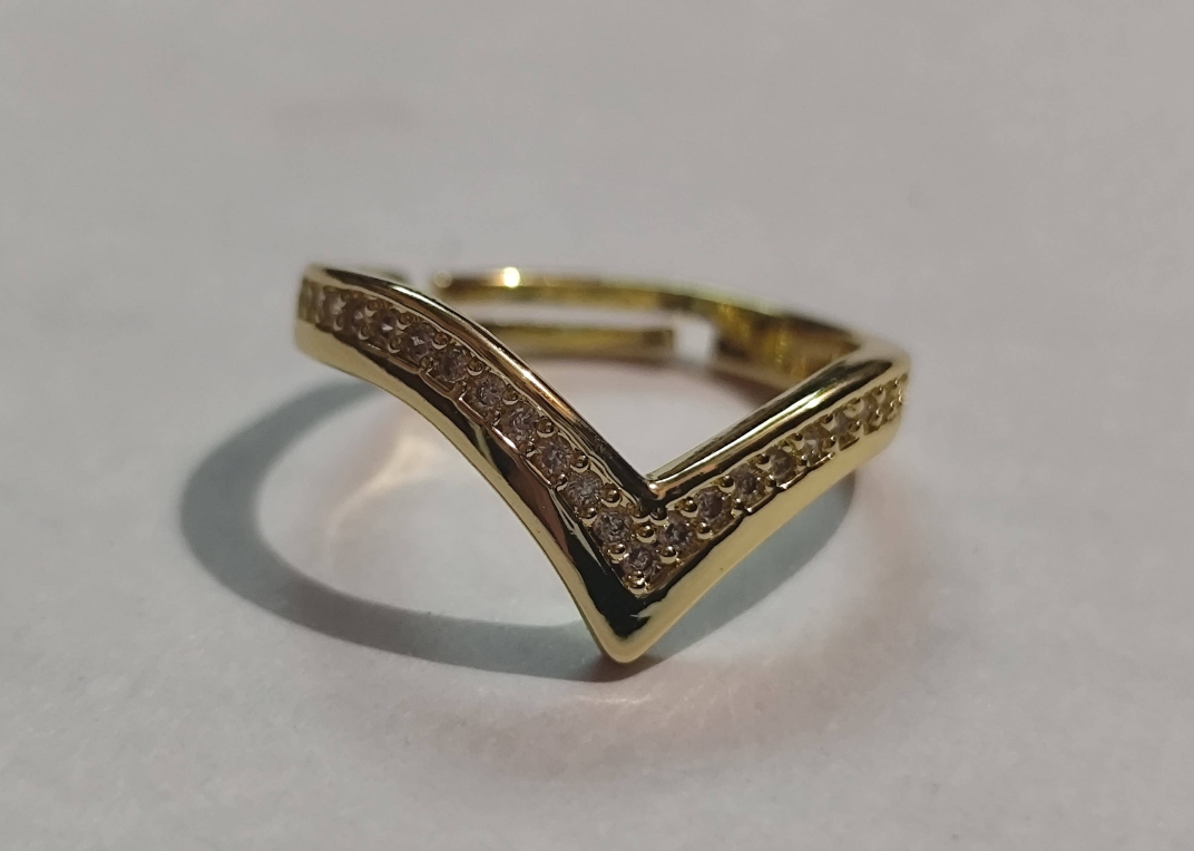 Gold chevron V-shaped ring with pave cubic zirconia stones