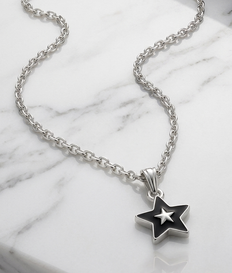 Black enamel star pendant necklace with silver star accent on silver chain