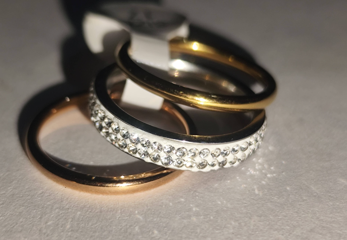 Set of three stacking rings in gold, rose gold, and rhinestone silver tones