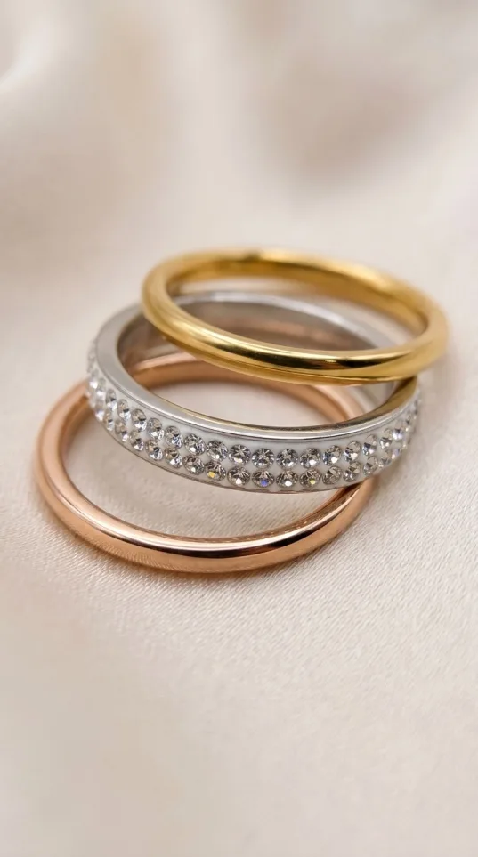 Set of three stacking rings in gold, rose gold, and rhinestone silver tones
