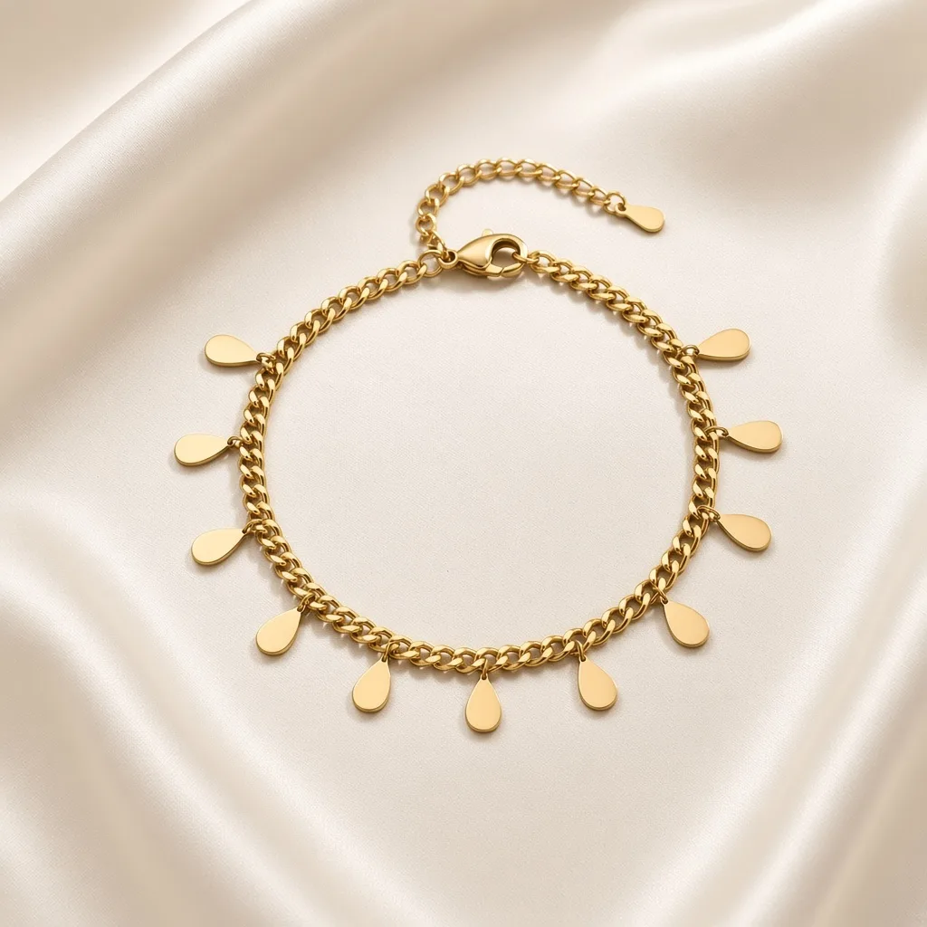 Gold teardrop charm bracelet on ivory — 18k gold plated anti-tarnish bracelet by The Luxe Jewels