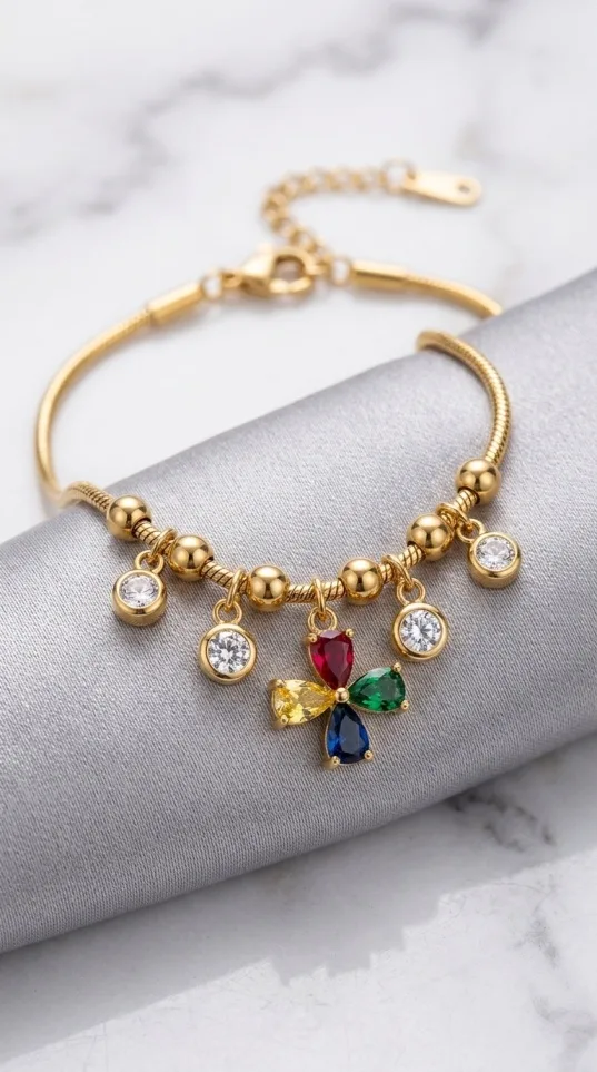 Gold chain bracelet with colorful crystal cross charm and dangles