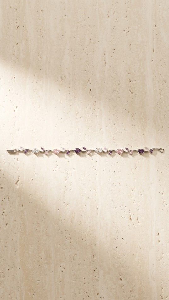 Elegant vine-style bracelet with multicolor stones and leaf design on satin fabric, stylish jewelry for women