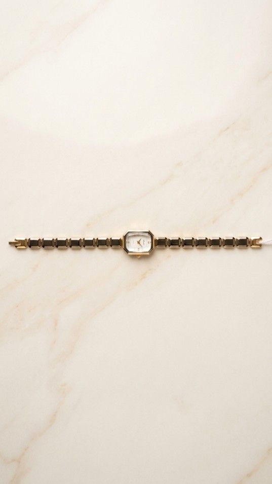 Elegant hexagonal dial bracelet watch with minimal design and sleek strap for women