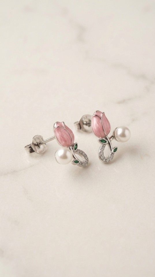 Pink floral pearl drop earrings with green leaf accents and sparkling stones, elegant women’s jewelry