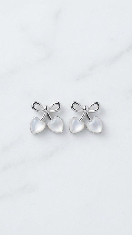 Silver bow stud earrings with heart-shaped pearl drops, cute and elegant jewelry for women