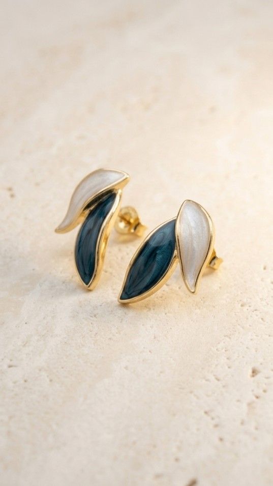 Gold dual tone leaf stud earrings with teal and pearl white enamel, modern minimal jewelry for women
